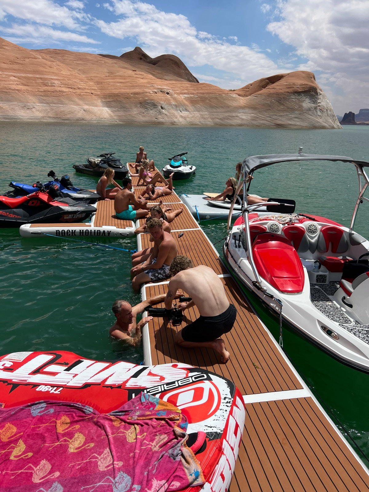 Friends relaxing on a Dock Holiday platform